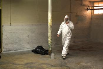 Safety first - work begins inside the former elementary school building on Oct. 30. (Photo by Wes Sterrs)