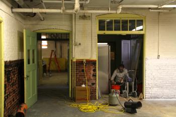 Working to renovate and prepare the old building for winter. (Photo by Wes Sterrs)