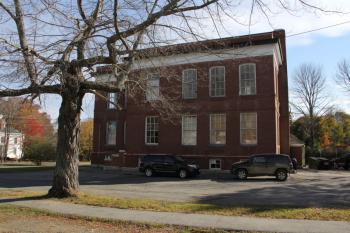 Future plans for the former elementary school and music academy have been put on the back burner as workers secure the building for the approaching winter. (Photo by Wes Sterrs)