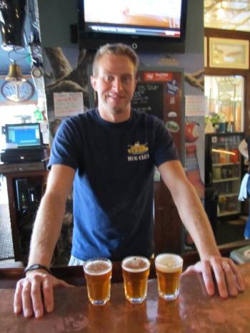 Dan Pease with samples of his three debut brews. (Photo by Kay Stephens)