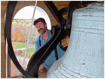 Steeplewright Bob Hanscom in the bell tower of the steeple he built for the Stockton Springs Community Church. (Photo by Ethan Andrews)