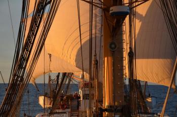 Under sail about the Eagle Sept. 9, sunset, offshore New England. (Photo by Lynda Clancy)