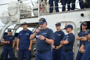 Chief Thomas Willard leads the daily morning muster aboard the Eagle.