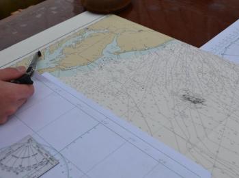 The Eagle spent a few days looping around waters off of Cape May, N.J., playing the wind, practicing a wear or two. The chart was well worn with pencil and eraser marks. (Photo by Lynda Clancy)