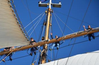 On the yardarm, ready to unfurl the sails. (Photo by Lynda Clancy)