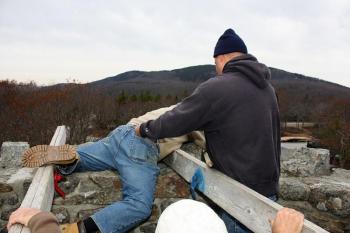 No, Peter Rollins is not tossing Tom Jackson over the top of the Mt. Battie Tower Saturday. See next photo... (Photo by Holly S. Edwards)