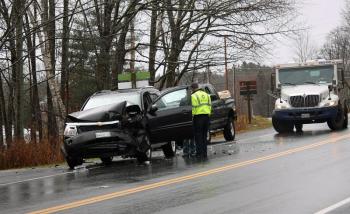 Despite appearances, the pickup truck and Brinks security truck in the background were not involved in the crash in Rockport Monday morning, they were witnesses and good Samaritans. (Photo by Holly S. Edwards)