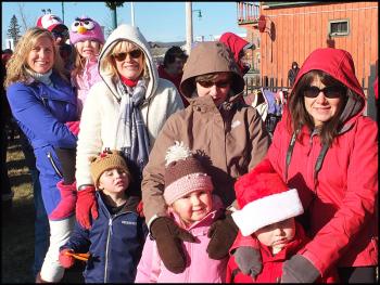 First in line to see Santa Friday afternoon, front to back, Kasey Garrison and Brayden, Krisite Garrison and Maddie, Celia knight and Phinn Shannon Kinney and Rachel Kinney. (Photo by Chris Wolf)