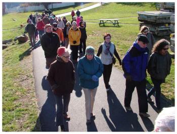 The group marches north through Heritage Park on the way to the trail’s end at the Armistice footbridge. (Photo by Ethan Andrews) The group marches north through Heritage Park on the way to the trail’s end at the Armistice footbridge. (Photo by Ethan Andrews)