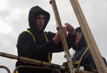 The next step is installing the light bulbs, 100 of them, which Ryan Fisher is doing here. (Photo by Holly S. Edwards)