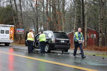 Sabrina Tyler of South Thomaston is checked out by North East Mobile Health Services medical personnel Tuesday morning and she crashed her SUV into the back of a VW passat. (Photo by Holly S. Edwards)