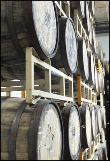 Barrels used for aging certain beers wait out their time at Shipyard Brewing. (Photo by Chris Wolf)