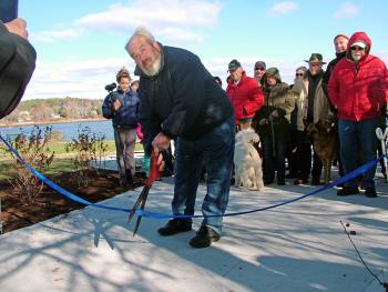 Mayor Walter Ash cuts the ribbon at the south end of the Belfast Harbor Walk during a grand opening ceremony, Nov. 9. (Photo by Ethan Andrews) Mayor Walter Ash cuts the ribbon at the south end of the Belfast Harbor Walk during a grand opening ceremony, Nov. 9. (Photo by Ethan Andrews)