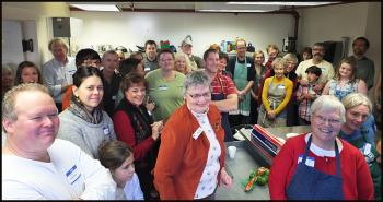 Just some of the 60 volunteers crowd into the kitchen at St. Peter’s Church at 11 White Street in Rockland before the annual Thanksgiving Day dinner. (Photos by Chris Wolf)