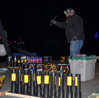 Donald Heald IV gets the grand finale in place at 4:30 in the afternoon. It’s already dark. (Photo by Lynda Clancy)