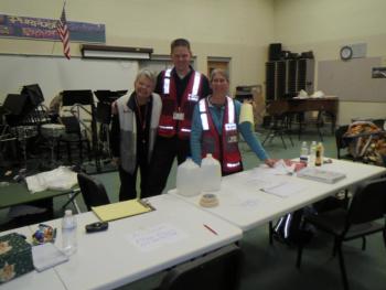 Red cross staff and volunteers greet people in search of warmth and power in the band room at Troy Howard Middle School. Staff said they had 11 people Monday night and as of 6pm Tuesday had over 20. 