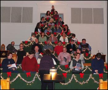 Choir members assemble on the tree.