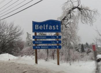  The welcome sign featured entering Belfast via Route 3 sits encrusted in ice Monday afternoon. 