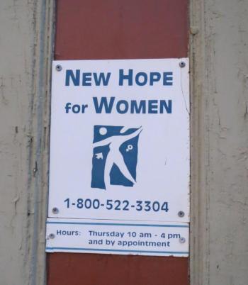 The sign for New Hope’s Belfast office, located directly across the street from the Belfast Police station.