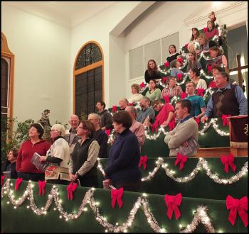 Members of the Living Christmas Tree Choir practice thursday evening for their upcoming performances. (Photos by Chris Wolf)