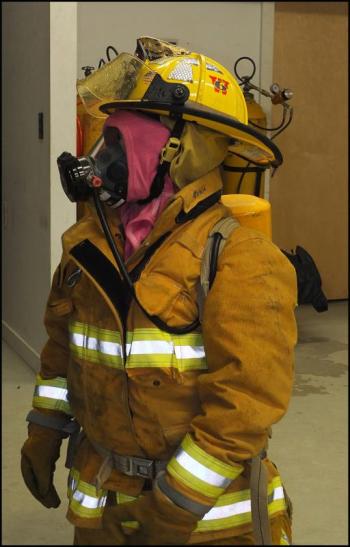 Erica Branhall, of Friendship, get tested on the time and correct placement of gear to become a firefighter.