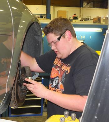 Sean Huges, Rockland works on automotive brakes.