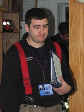 Jerrad Dunsmore evaluates candidates for fire school in Bangor. "It's their first step in becoming a foirefighter," he said.