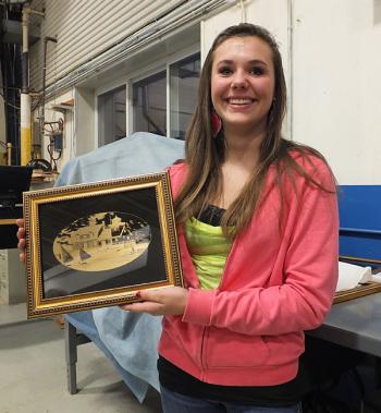 Mckayla Paulsen displays her laser print project.