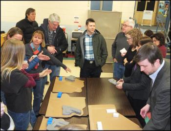 Members of the public and school board look over design concepts for the renovation project of Camden-Rockport Middle School. (Photos by Chris Wolf)