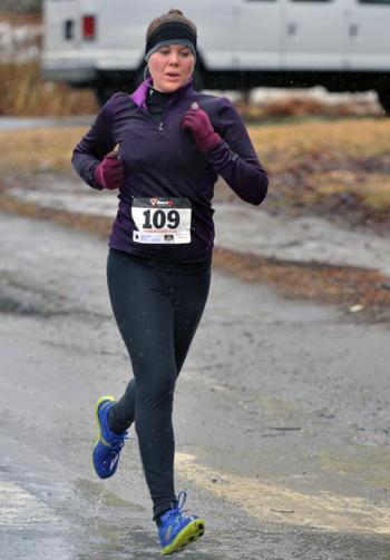 Caitlin Cross was the first female and third overall to cross the finish line. (Photo by Ron Hawkes)