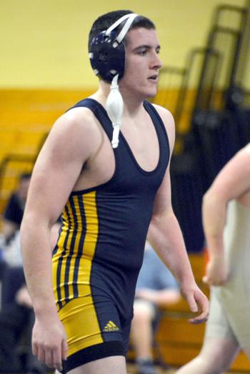 Cyril Miller ends his high school years wrestling with career wins and as pins record holder for Medomak Valley High School. (Photo by Ron Hawkes)