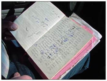 A handwritten log of the towns Wiggin covers, annotated with the date of his most recent visit. (Photo by Ethan Andrews)