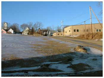 A planned renovation of Cross Street came under fire Tuesday for proposed parking that would cut into Belfast Common on the south side of Miller Street. Pictured here, the area would be on the near side of the street running up the hill. (Photo by Ethan Andrews)