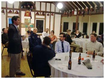 Capt. David Gelinas of the Penobscot Bay and River Pilots Association, left, urges members of the Propeller Club to attend hearings and public meetings on the proposed dredging or risk losing Searsport’s viability as a commercial port. (Photo by Ethan Andrews)
