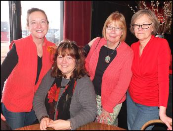 Ladies in red at the reception left to right: Roberta Baufann, Carol Miller, Marie Ilvonen and Rhonda Nordstrom.