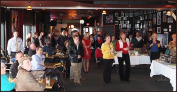 Reception crowd at Time Out Pub. Pub owner JB Beaulie said he provides the space free of charge to groups and has recently renovated the space.