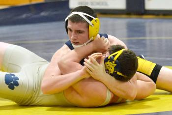 Cyril Miller broke Medomak Valley High School’s career wins total with this pin against a Mount Blue wrestler last weekend. (Photo by Ron Hawkes)