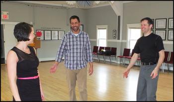 Jessica Libby, Allie Bowen and Christian Clayton go over the steps before trying a complicated move.