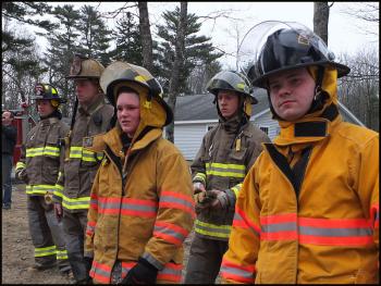 Rockport firefighters watch the last fire Sunday. (Photo by Chris Wolf)