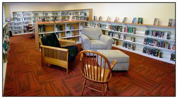 The library’s new teen space has comfortable furniture and several tables and chairs for studying. Soon it will have computers and a monitor for the occasional gaming event. (Photo by Ethan Andrews)
