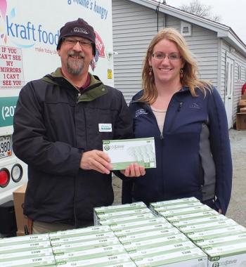 A representative from Efficiency Maine and Tia Harris of the Good Shepherd Food Bank. (Photo by Chris Wolf)