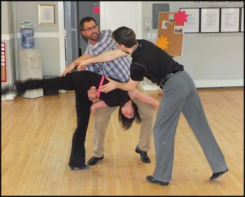 "It's easy, if you do it the right way," Christian Clayton explains as he shows Allie Bowen how to twirl Jessica Libby.