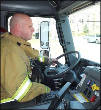 Patrick Lowe pulls the truck from the fire station