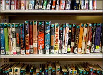 “Killer Pizza” and “Lips Touch” have replaced “Harry the Dirty Dog” and “Don’t Let the Pigeon Drive the Bus” in the Belfast Free Library’s new second-floor teen space. (Photo by Ethan Andrews)