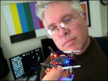 Belfast Community TV Station Manager Ned Lightner with a toy quadcopter, similar in design to (but much smaller than) the one he and BCTV contributor Mark Kuzio bought to give viewers of the public access channel a bird’s eye view. (Photo by Ethan Andrews)