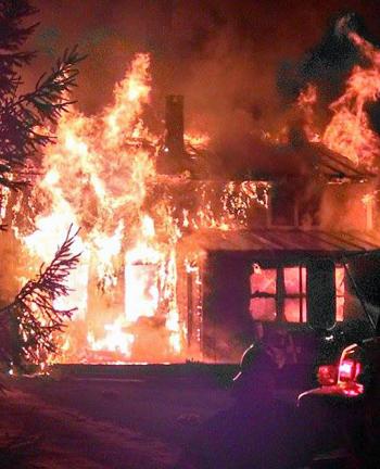 Searsmont firefighter Tracy Harford said this is what the house looked like when he arrived on scene. (Courtesy Tracy Harford)