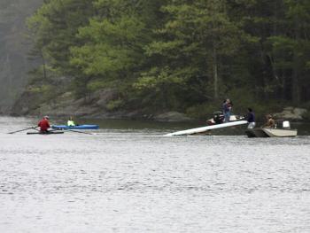 The missing rower’s sculling boat is righted on the lake Tuesday. (Photo by Holly S. Edwards)