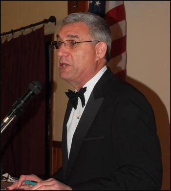 Master of Ceremonies retired Chief Warrant Officer Paul Dilger.