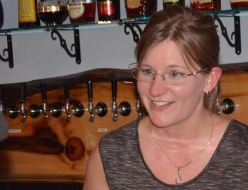 Kristen Anderson, helping out behind the bar. (Photo by Lynda Clancy)