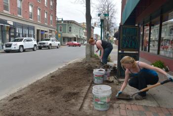 The girls work hard to clean out the old and get it ready for the new. (Photo by Ron Hawkes)